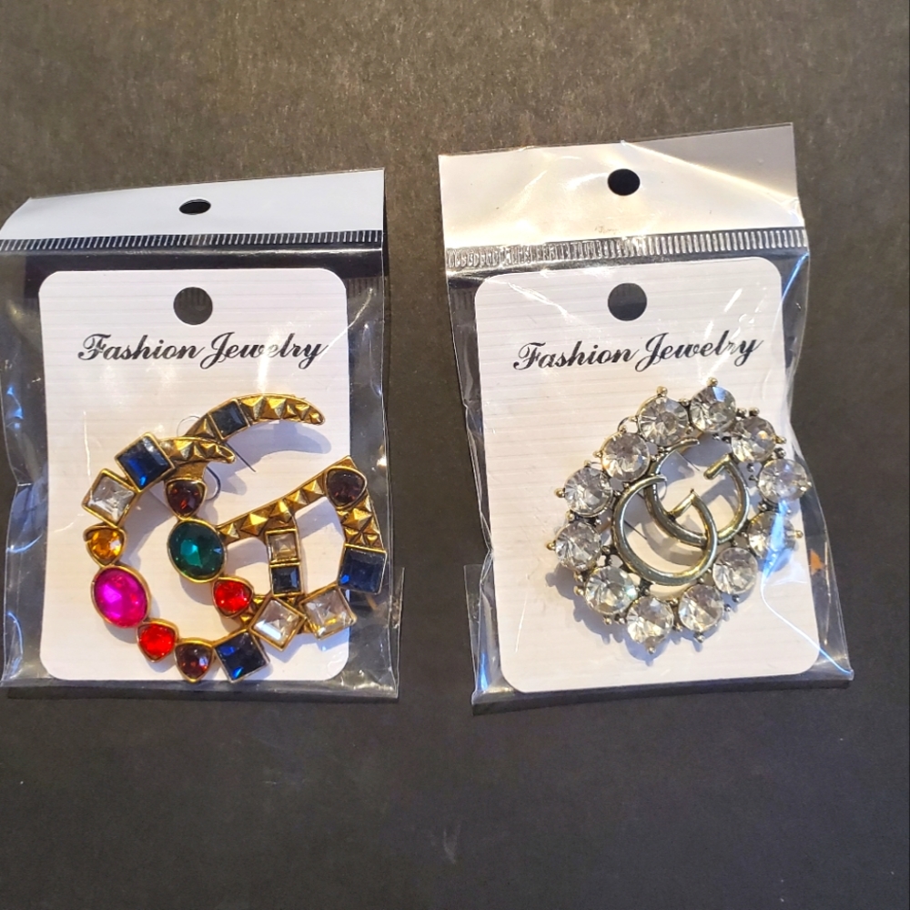 Pair of "designer" brooches